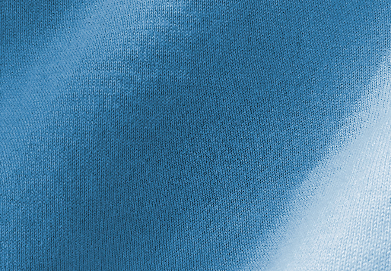 A close-up of a light blue jersey knit swatch.